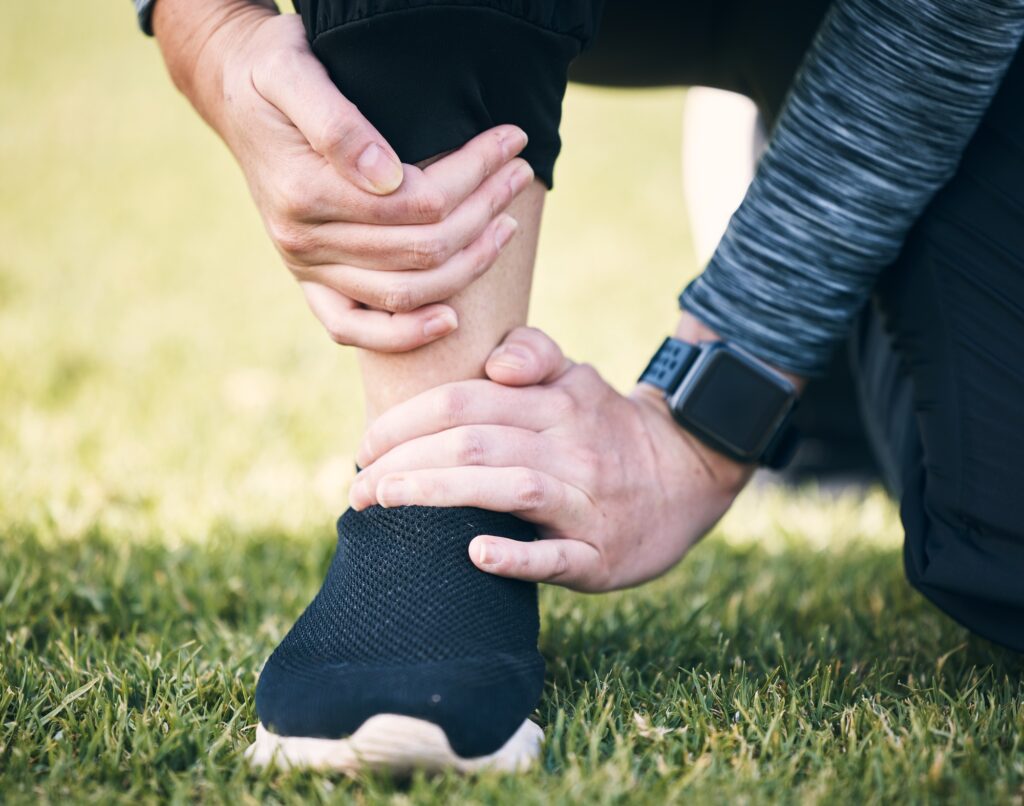 Closeup woman, pain and ankle injury outdoor from fitness accident, emergency or first aid risk at